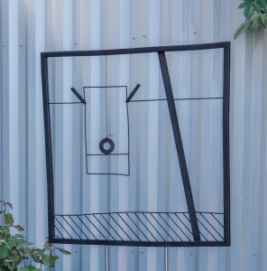 Steel sculpture representing a drawing on paper pinned on a clothes line